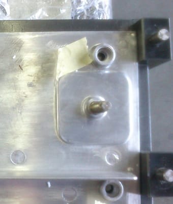 The cast insert positioned within the aluminum die casting LED enclosure mold