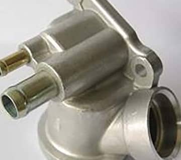 Cast Aluminum vs Die Cast: Which is Right for You? 4 cast aluminum parts used in automotive parts such as cylinder heads, engine blocks.